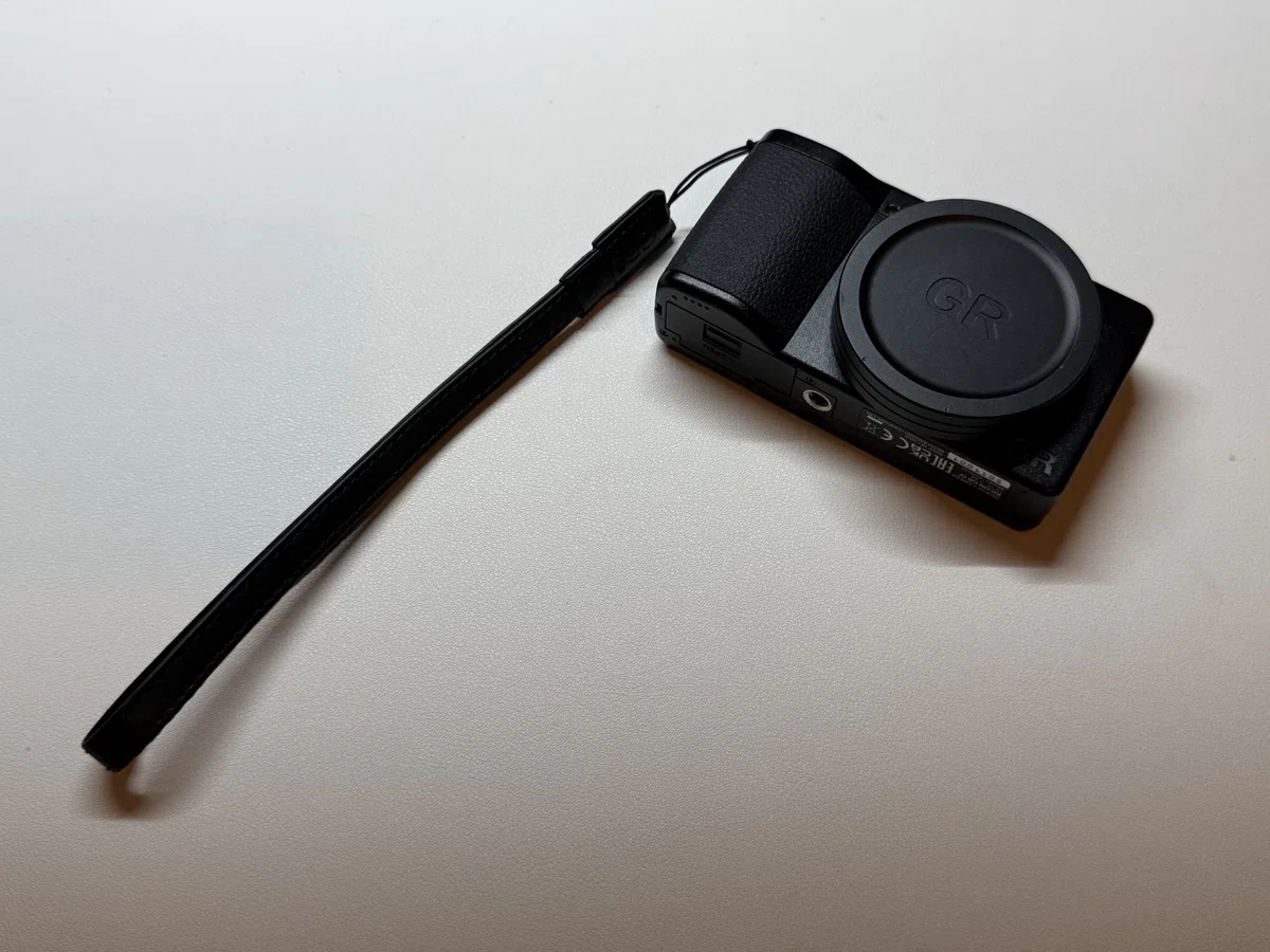 Ricoh GS-2 wrist strap attached to a Ricoh GR IV
