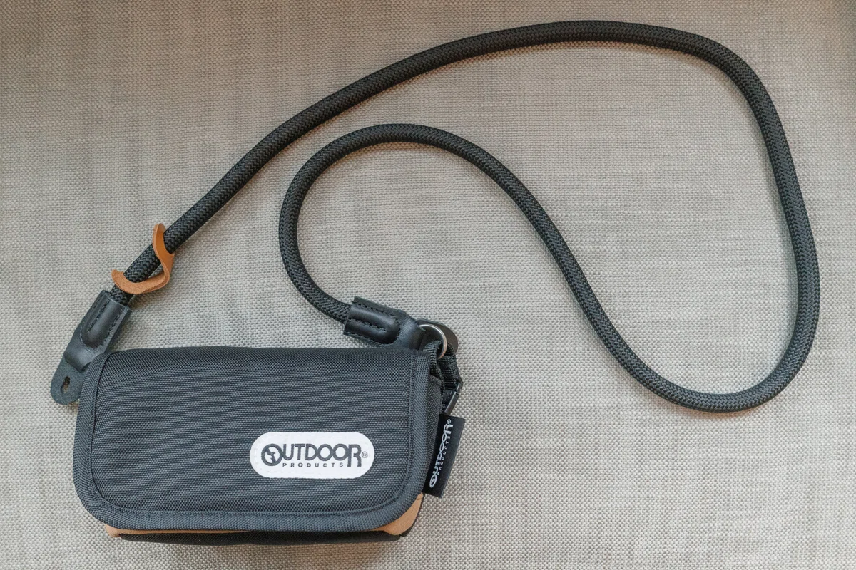 Completed neck-strap camera pouch setup for the Ricoh GR IV
