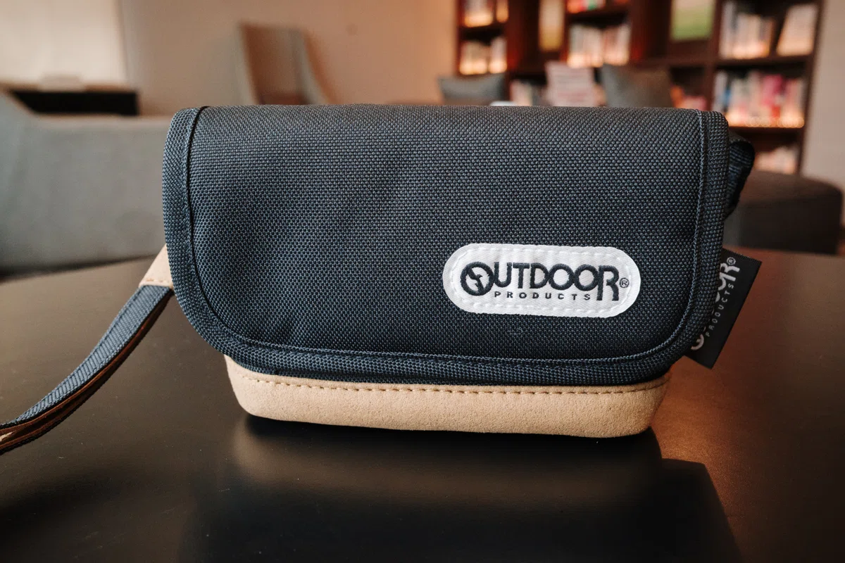 Black camera pouch and neck strap designed to match the Ricoh GR IV