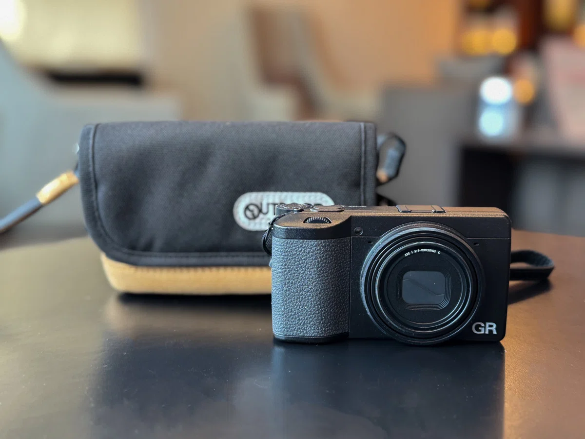 Size comparison between the OUTDOOR PRODUCTS Camera Pouch 05 and the Ricoh GR IV