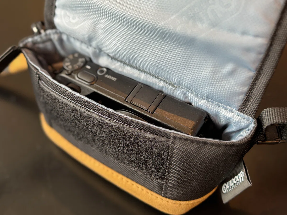 Ricoh GR IV fitting neatly inside the camera pouch with a little room to spare