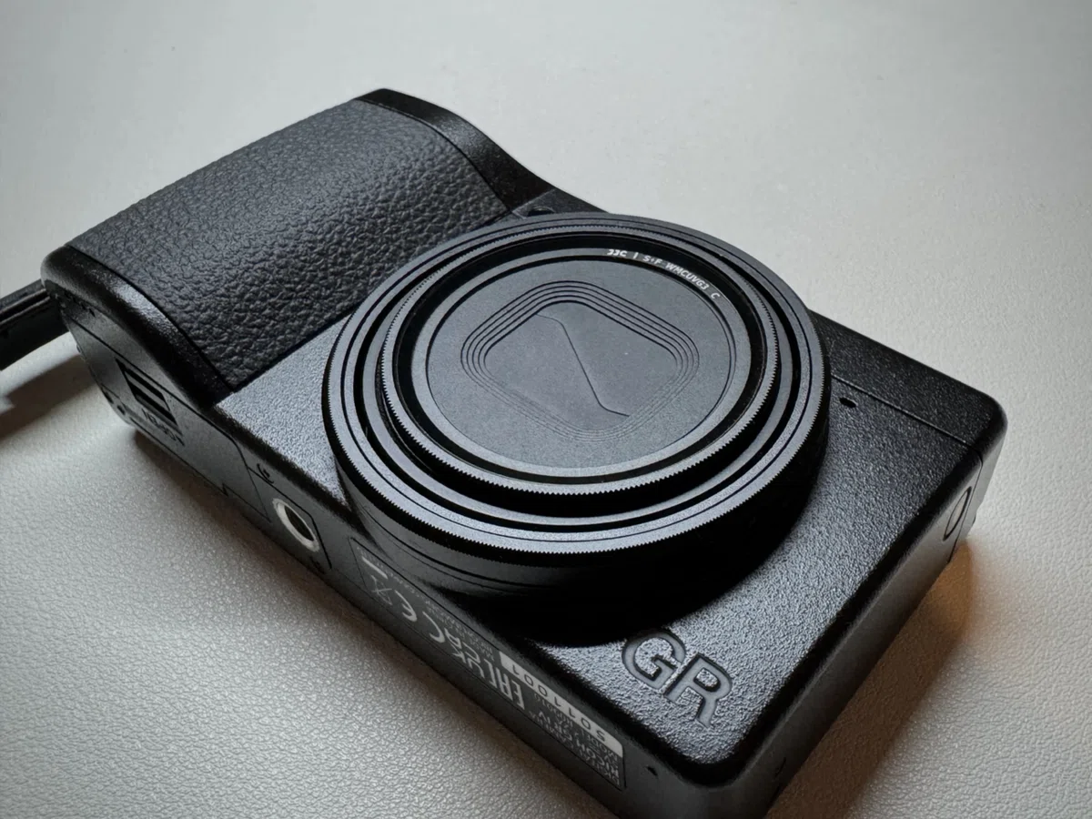 JJC UV filter attached to a Ricoh GR IV