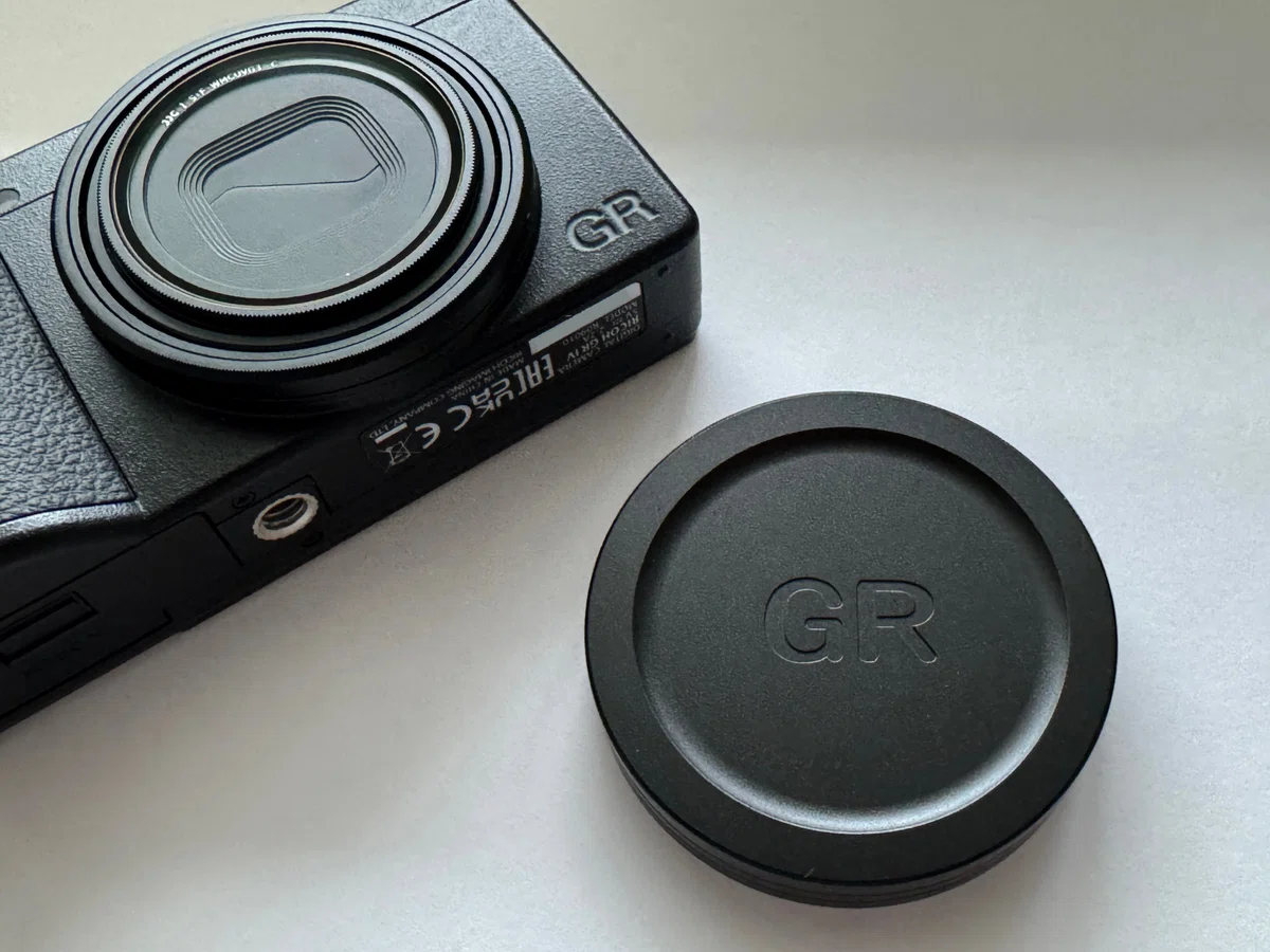 Ricoh GR IV with metal lens cap attached